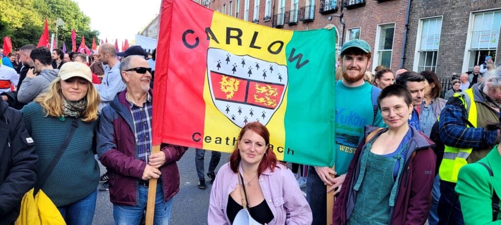 Councillor Adrienne Wallace campaigning in front of the Carlow banner in Dublin.