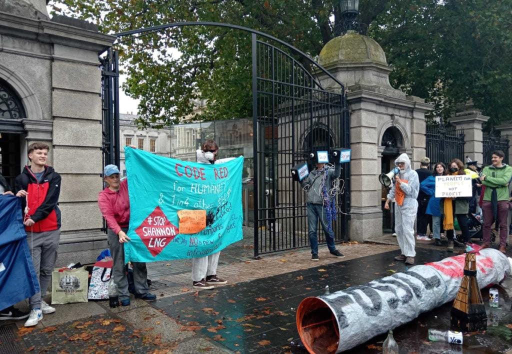 Protestors at the Dáil against the Green Party of Ireland opening the way to import LNG Liquid Natural Gas a fossil fuel.