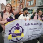 Campaigners marching behind a banner saying A Right To Refuge. Features People Before Profit's Carlow Councillor Adrienne Wallace.