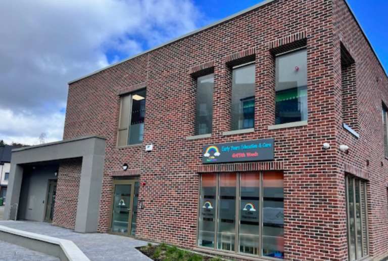 Image the exterior of a newly built brick early years education building