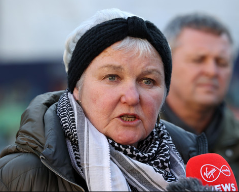 PBP TD Bríd Smith speaking behind a press microphone