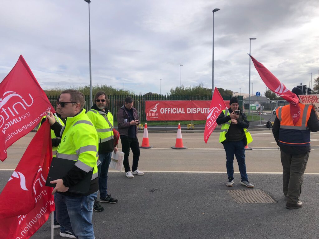 People Before Profit's Mark Kerins standing with workers on the Unite picket 7 October 2024.