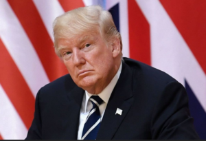 Trump in front of UK and US flags